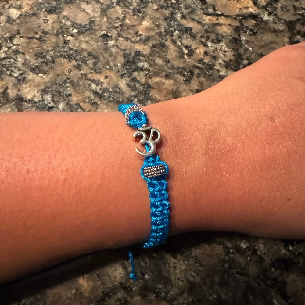 Blue Braided Bracelet / Rakhi with Silver ‘Om’ Charm